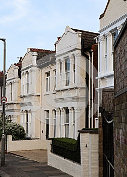 Typical houses for rich english persons. An unassailable alleyway near the famous part of London Wimbledon. Old-school photo