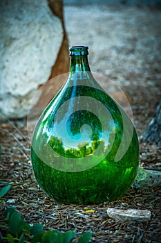 Typical huge green glass oil bottles