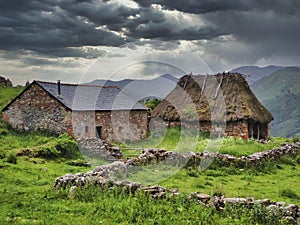 Typical huts in brana Mumian, Somiedo Natural Park, Asturias, Spain photo