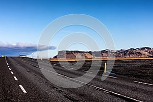 Typical Iceland landscape with road and mountains.