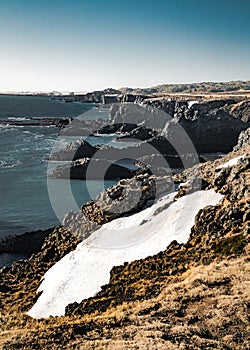 Typical Icelandic sunrise sunset cliff landscape at Arnarstapi area in Snaefellsnes peninsula in Iceland