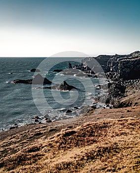 Typical Icelandic sunrise sunset cliff landscape at Arnarstapi area in Snaefellsnes peninsula in Iceland