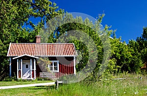 Typical idyllic cottage in Sweden .