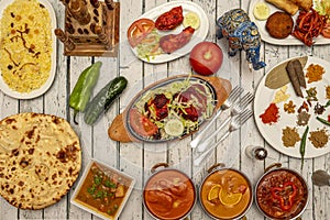 Typical Indian food dishes with many curries, mild and strong, naan