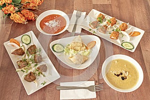 Typical Indian food dishes with red curry, yellow korma, coconut,