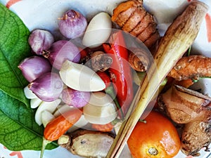 Typical Indonesian kitchen spices, namely shallots, garlic, tomatoes, turmeric, bay leaves, galangal, chilies, lemongrass