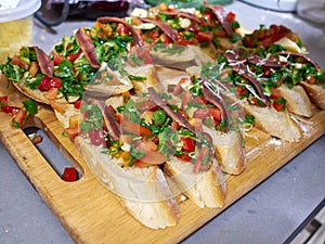 Typical Italian Bruschetta with tomatoes, herbs and oil on toast