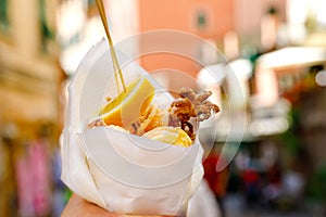 Typical Italian Seafood Fritto Misto di Pesce, Mixed fried fish, Liguria, Italy, Europe. Healthy snack in Genoa, Cinque