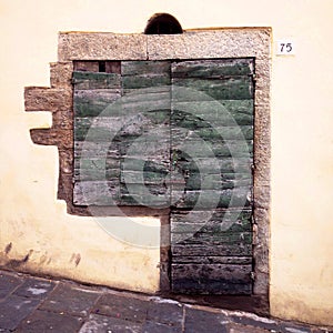 Typical italian wooden antique window and door, granite edged