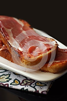 Typical Jamon Serrano ham tapa from Spain