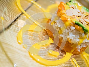 Typical Japanese dish of sushi, rice and fish, with sauce, salad, sushimi and sesame