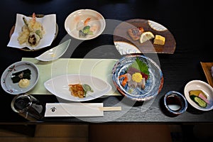 Typical Japanese food Sushi, tofu, tempura, glass noodles, seaweed as starters in a restaurant in Akita, Japan.