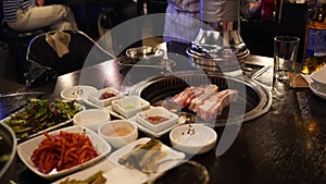 Typical korean bbq grill. Korean barbecue cooked and served at a restuarant.
