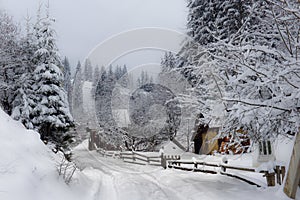 Typical landscape of the Ukrainian Carpathians with private estates in winter