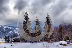 Typical landscape of the Ukrainian Carpathians with private estates in winter