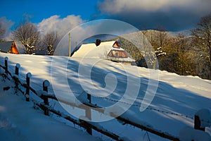 Typical landscape of the Ukrainian Carpathians with private estates in winter