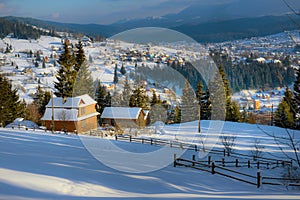 Typical landscape of the Ukrainian Carpathians with private estates in winter