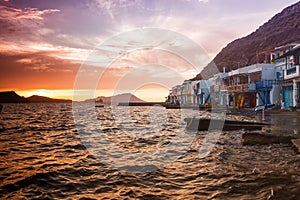 The typical little village of Klima in Milos island Greece at sunset.