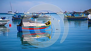 Typical Luzzu colorful fishing boats of Valletta, Malta