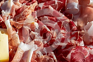 Sauris - Typical meat plate served in traditional mountain cottage in Carnic Alps, Friuli Venezia Giulia