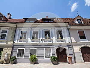 Typical Medieval Facade of an old appartment residential building in a street of old town, the historical center of Ljubljana