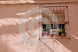 Typical Mediterranean window with flowers.