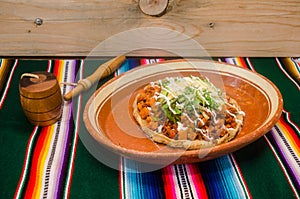 Traditional mexican gordita over a sarape photo