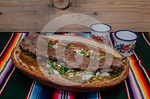 Traditional mexican huarache in clay dish photo
