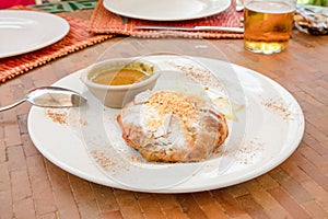 Typical Moroccan chicken bisteeya on a white dish