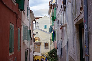 Typical narrow alley with croatian houses in the picturesque old town of Rovinj, Croatia