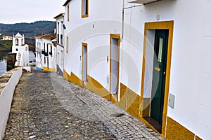 Typical narrow street in the ancient town of Mertola, Alentejo R