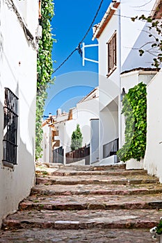 Typical narrow street in Calella photo