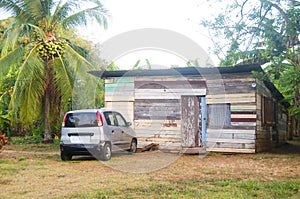 Typical native Nicaraguan wood clapboard house with taxi jungle photo