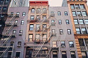 Typical New York apartment blocks with fire escape at the front in NoHo, New York City, USA