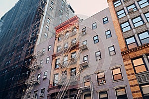 Typical New York apartment blocks with fire escape at the front in NoHo, New York City, USA