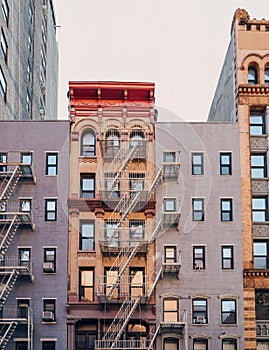 Typical New York apartment blocks with fire escape at the front in NoHo, New York, USA