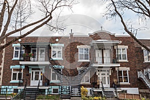 typical North American red bricks residential houses in autumn in Le Plateau district, one of the wealthy districts of Montreal