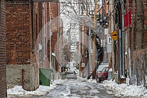 Typical North American residential dead-end alley street covered in snow in a residential part of Montreal, Quebec, Canada
