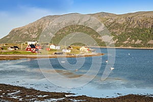 Typical Norwegian fishing village with traditional red rorbu hut