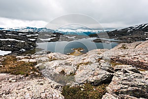 Typical norwegian landscape with snowy mountains