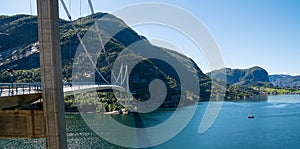 Typical Norwegian view of the bridge across the fjord. Colorful summer day in the Norway. Travel concept. Artistic picture. Beauty