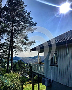 A typical Norwegian Wooden home overlooking Trees and Mountains. Kristiansand, Norway.