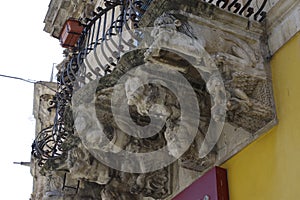 Typical old balcony with baroque style ornaments