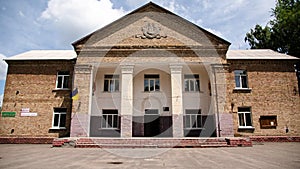 Typical old brick building with Soviet symbols