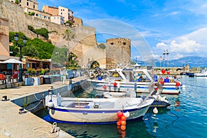 Typical old fishing boats in Calvi port on sunny summer day, Corsica island, France