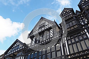 Typical old half timbered black and white tudor style buildings in Chester England