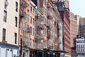 Typical old houses with facade stairs in NYC