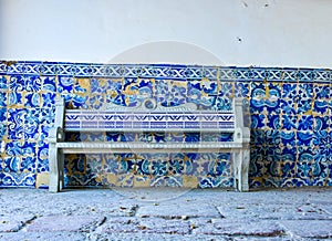 Typical old portugese blue and white tile wall decoration with tile bench