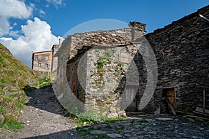 Typical old stone house with wooden door in Ushguli, Georgia. Traditional architecture of Ushguli