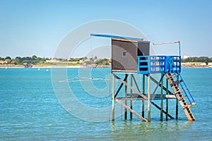 Typical old wooden fishing hut on stilts in the atlantic ocean near La Rochelle France